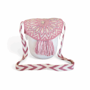 Pink rhinestone flap Wayuu mochila bag handwoven in Colombia with fringe and geometric strap.
